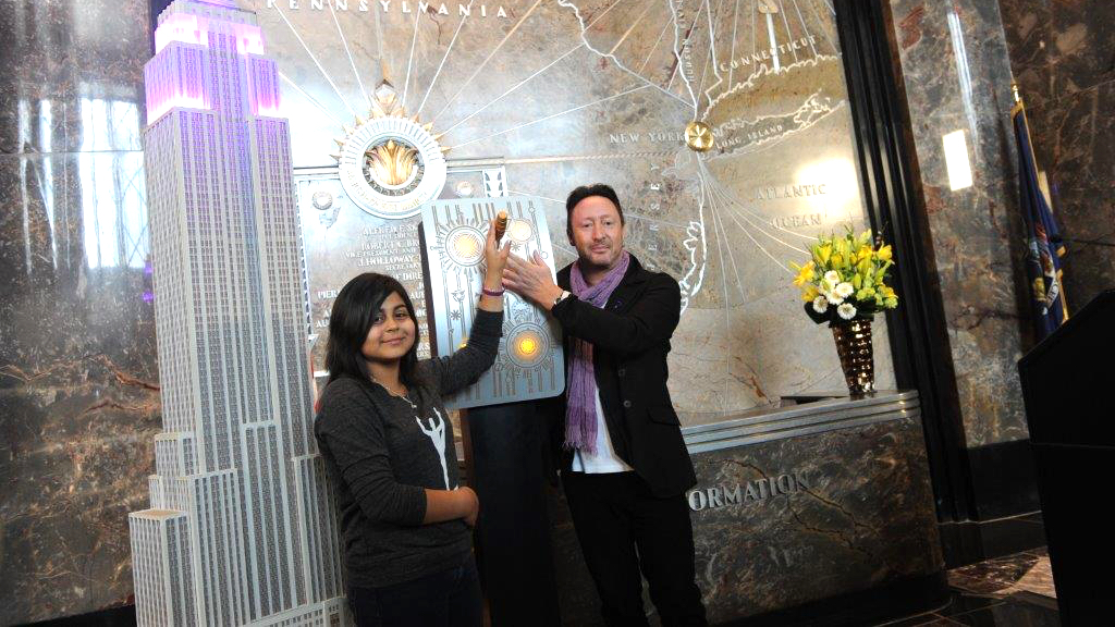 Amarissa and Julian Lennon, LFA's Global Ambassador, illuminating the Empire State Building in purple light.