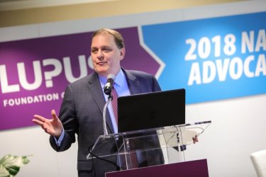 Steve Gibson at a podium at the 2018 Lupus Advocacy Summit